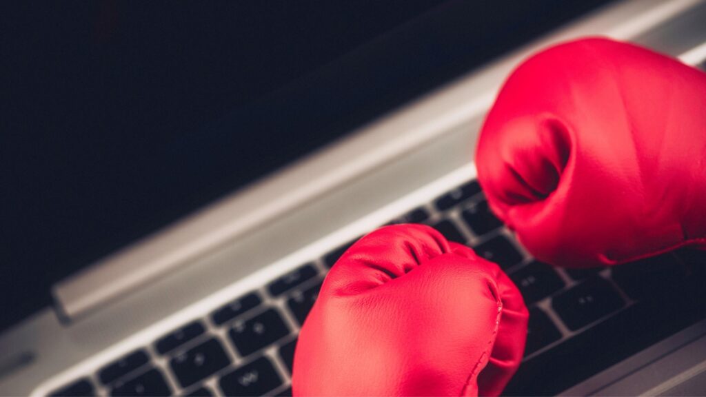 boxing gloves on a computer keyboard