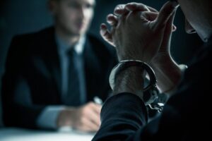 Someone who has been arrested talking with their attorney - Bail in New Jersey