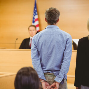 Man standing in front of judge at Probable Cause Hearing / Pretrial Detention Hearing - Criminal Defense attorney - Shuttleworth Law